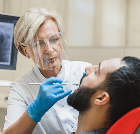 Patient getting her tooth extracted
